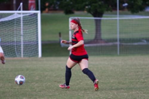 Woman plays soccer